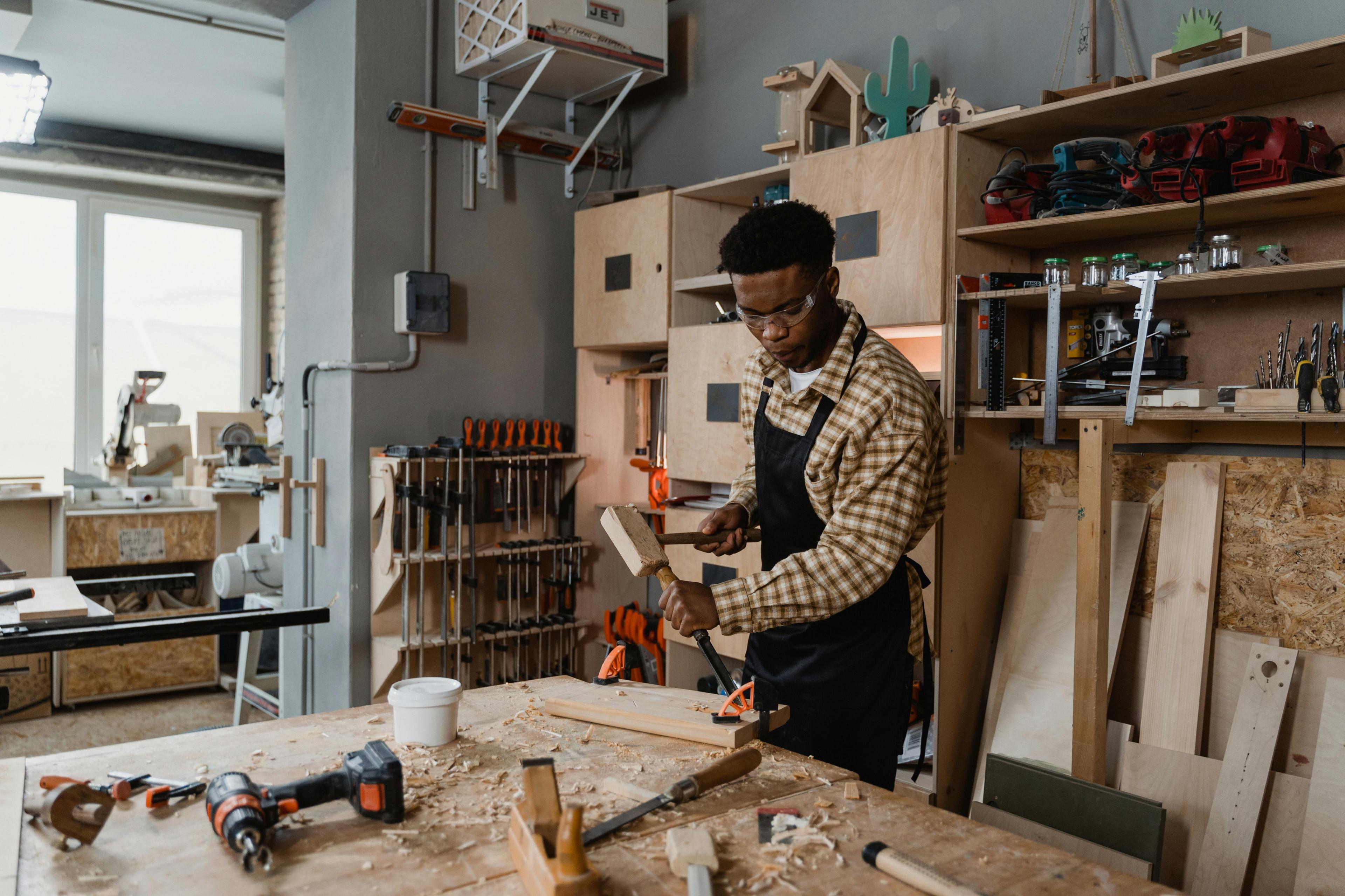 Professional carpentry workshop with wood working tools and finished furniture